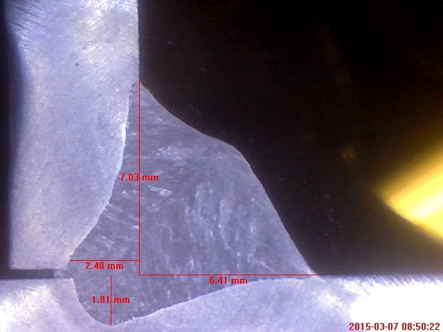 Inspection image of Dalsin steel MIG weld, depicting weld root fusion and penetration beyond the joint root.