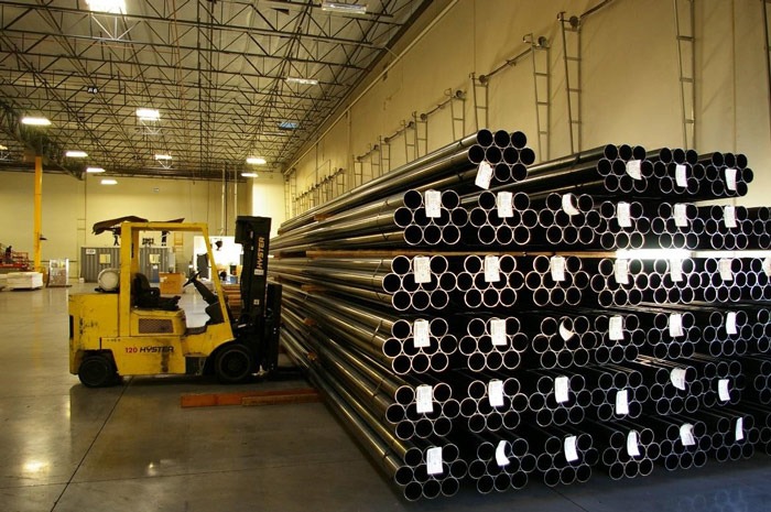Tube inventory staged to be loaded into automated material handling system for robotic welding.